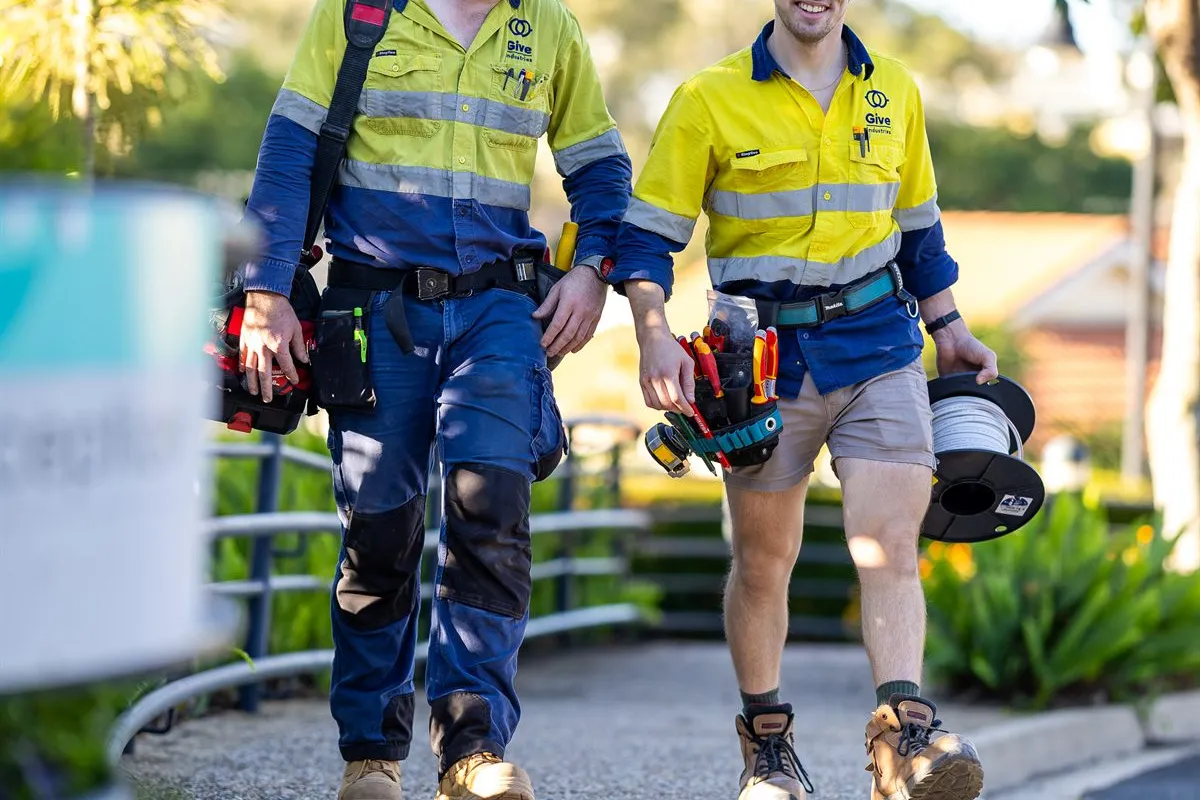 Give Industries team members in high visibility workwear